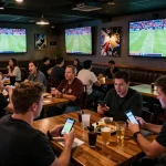 FC88 sports enthusiasts placing bets in a lively sports bar during a major event.
