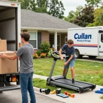 A family packing a moving truck with boxes while preparing for a long distance moving company experience.